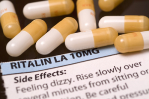 Ritalin pills and warning label.